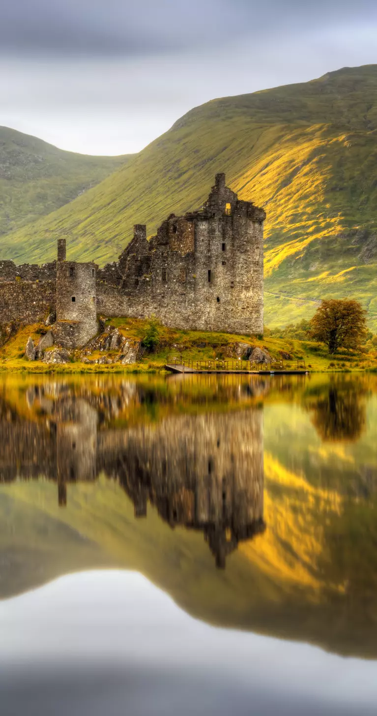 Reflections in Loch Awe at sunset of Kilchurn Castle, Scotland