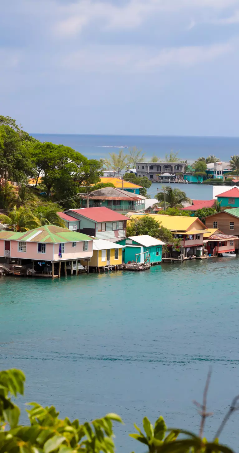 Colorful wooden stilt homes located at a seaside village on Roatain, which is part of the Bay Islands of Hondouras