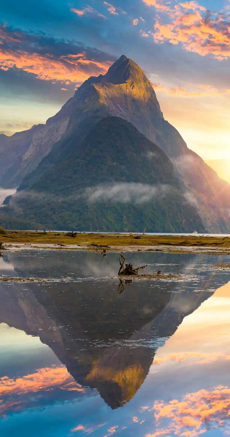 Famous Mitre Peak rising from the Milford Sound fiord. Fiordland national park, New Zealand