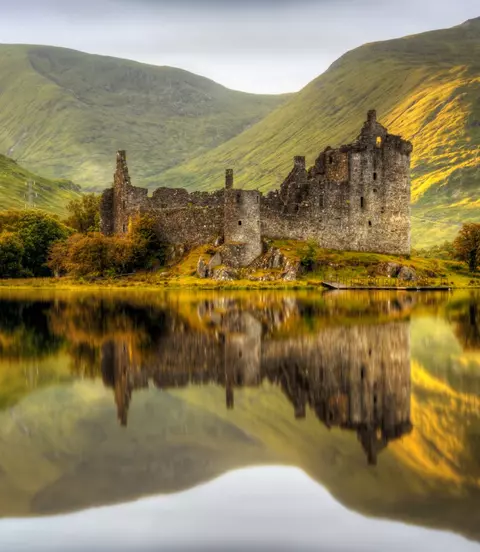 Reflections in Loch Awe at sunset of Kilchurn Castle, Scotland