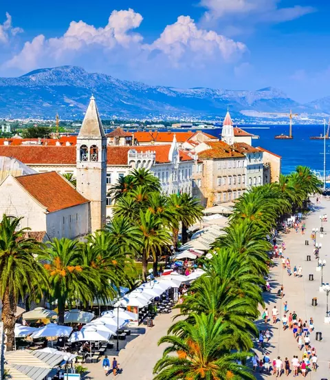 Sunny promenade along the pier of old Venetian town, Dalmatian Coast.