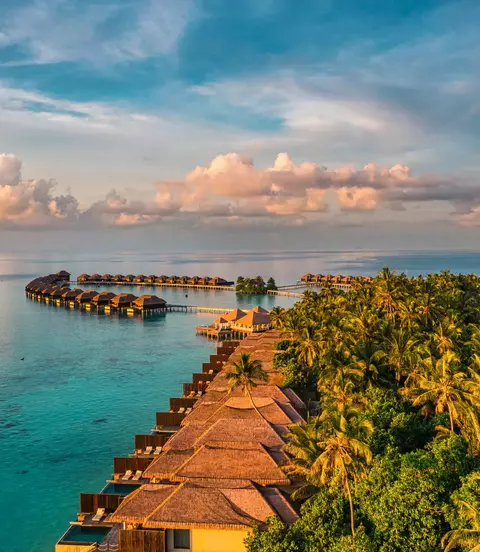 Aerial view of bungalows over the ocean in the Maldives