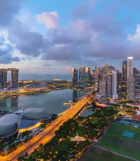 Singapore landmark city skyline, with iconic three tower Marina Bay Sands, during sunrise