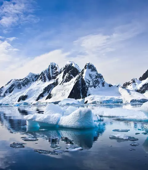 Beautiful snow-capped mountains against the blue sky in Antarctica