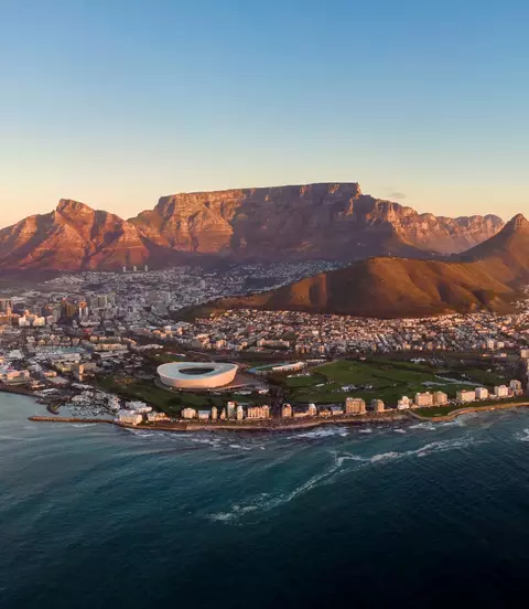 Aerial panoramic view of Cape Town cityscape at sunset, Western Cape Province, South Africa.