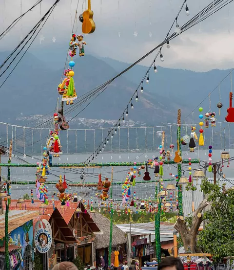 Hanging umbrellas in the colorful streets of San Juan La Laguna at Lake Atitlan, Guatemala