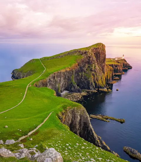 Lightouse at edge of cliff overlooking atlantic ocean
