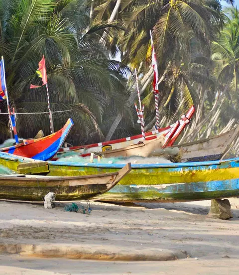 Traditional wooden fishing boats (pirogues) moored at the beach