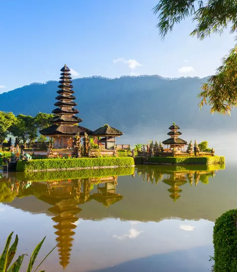 Famous temple with morning mists over the Danau Beratan lake
