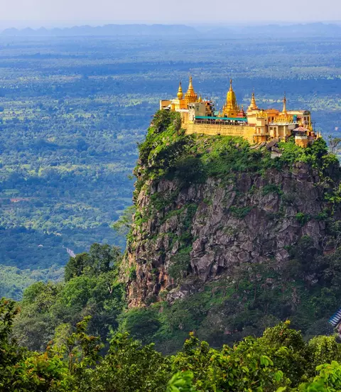 Built high on the volcanic plug of Mount Papa, Taung Kalat is a Buddhist monastery and temple
