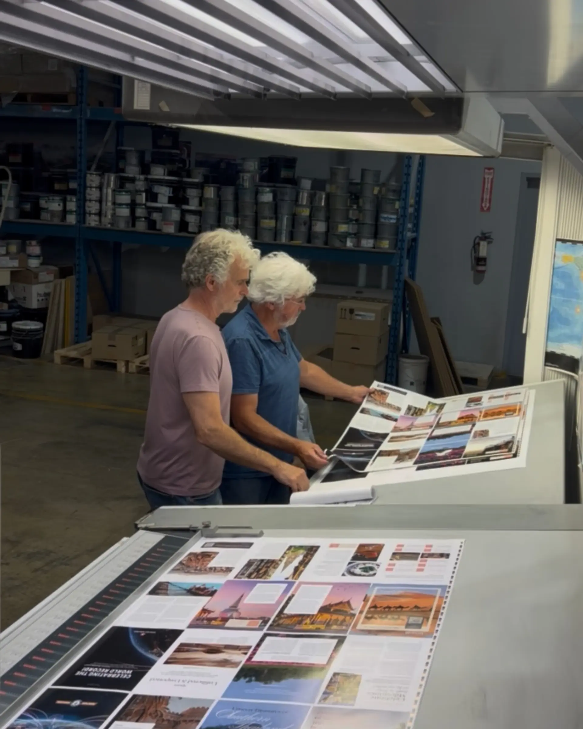 Press check for Globetrotting magazine Vol. 38, with printed sheets of travel story pages inspected on press at the printer