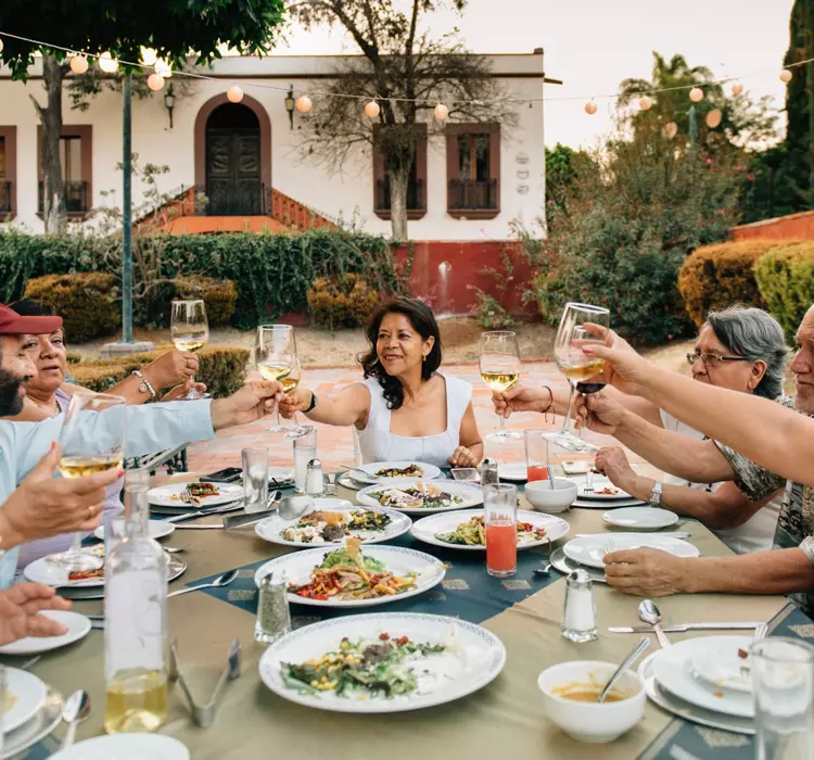 A travel group dines together