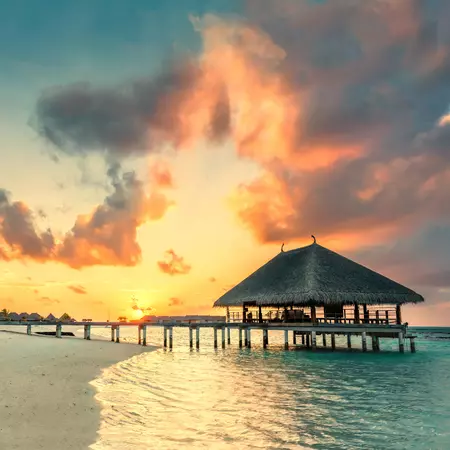 Enjoy a sunset in the Maldives