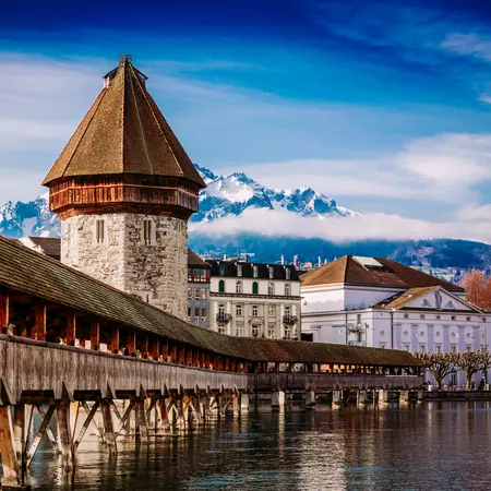 Cross the historic Chapel Bridge in Lucerne