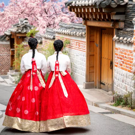 Asian woman traveler in traditional korean dress