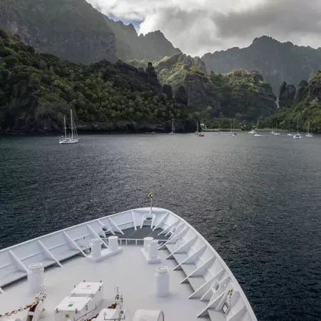 Cruise Ship arriving to Hanavave Bay in the Marqusas Islands, French Polynesia