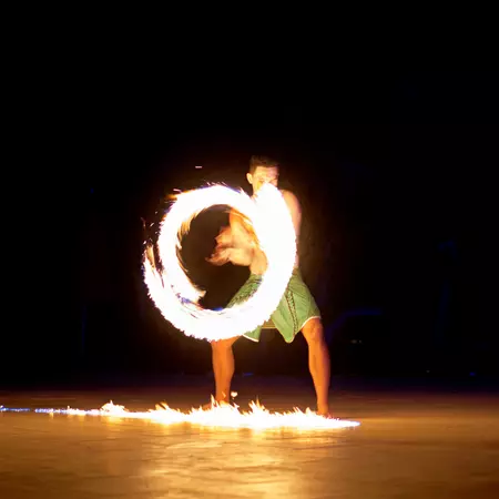 Fire dancer performing traditional dance in Fiji