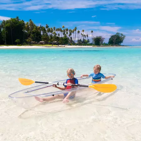 Kids kayaking in ocean