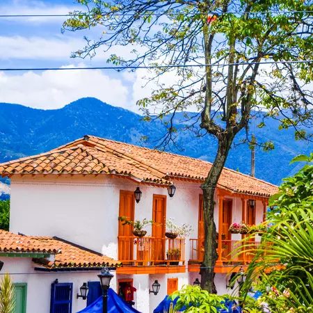 Facade view of clay rooftops with some colorful buildings in Pueblito Paisa in Nutibara Hill