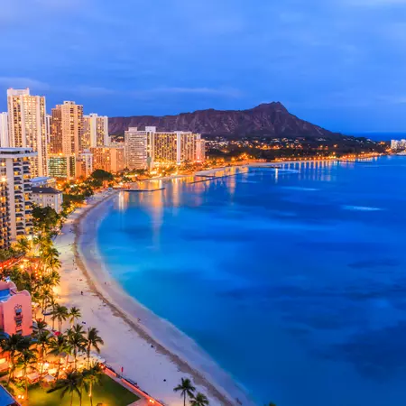 Explore the nightlife of Honolulu with the Diamond Head Crater serving as your backdrop