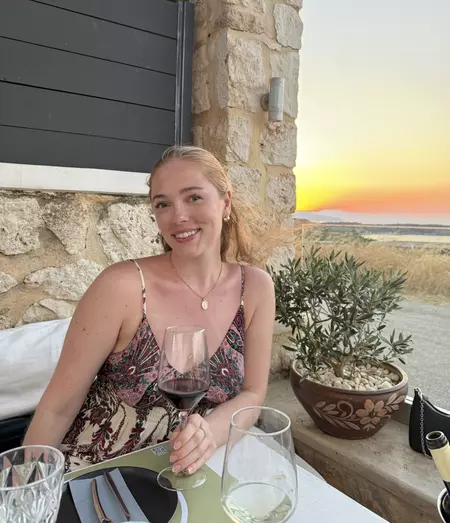 Phoebe Gould at dinner on vacation