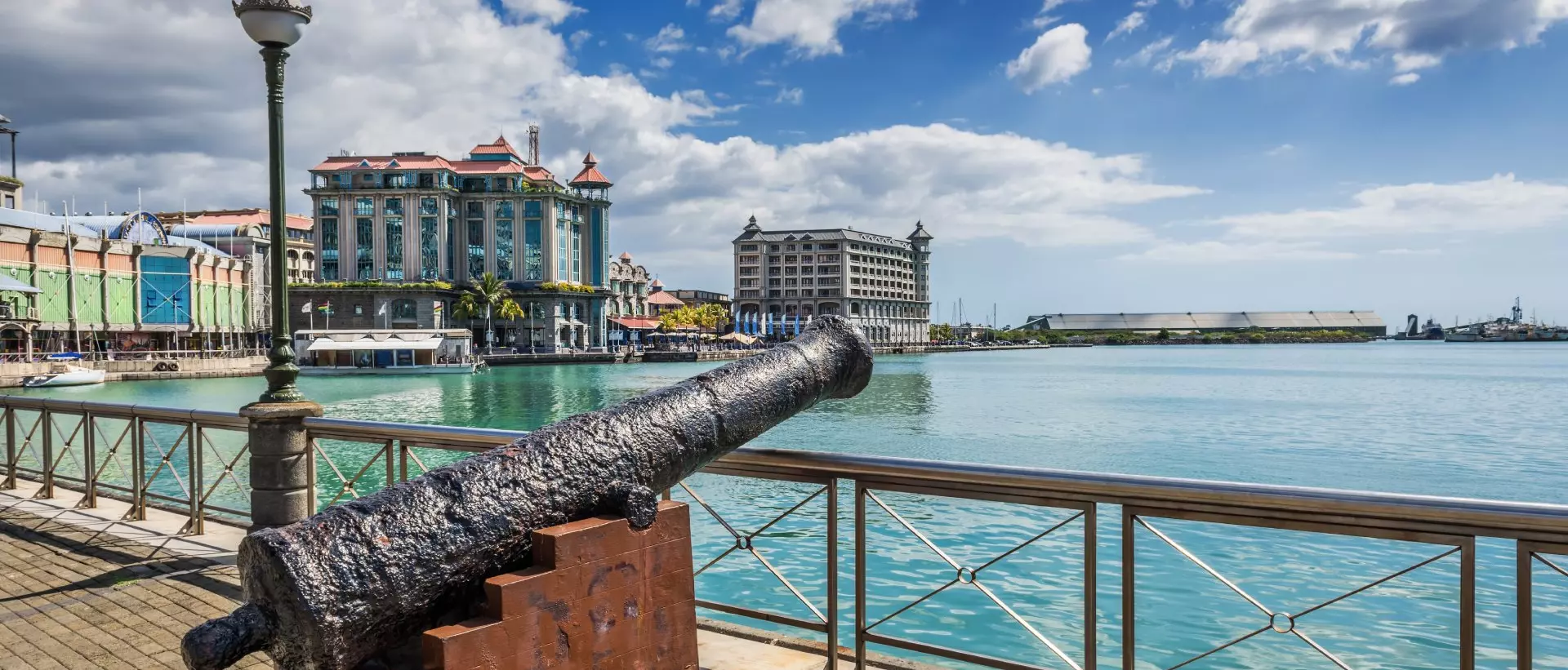 Old cannon on the promenade at Caudan Waterfront, Port Louis, Mauritius.