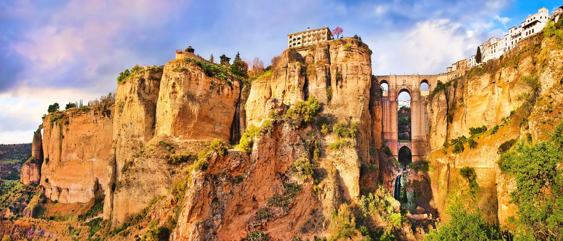 Panoramic view of the old city of Ronda, one of the famous white villages, at sunset in the province of Malaga, Andalusia, Spain