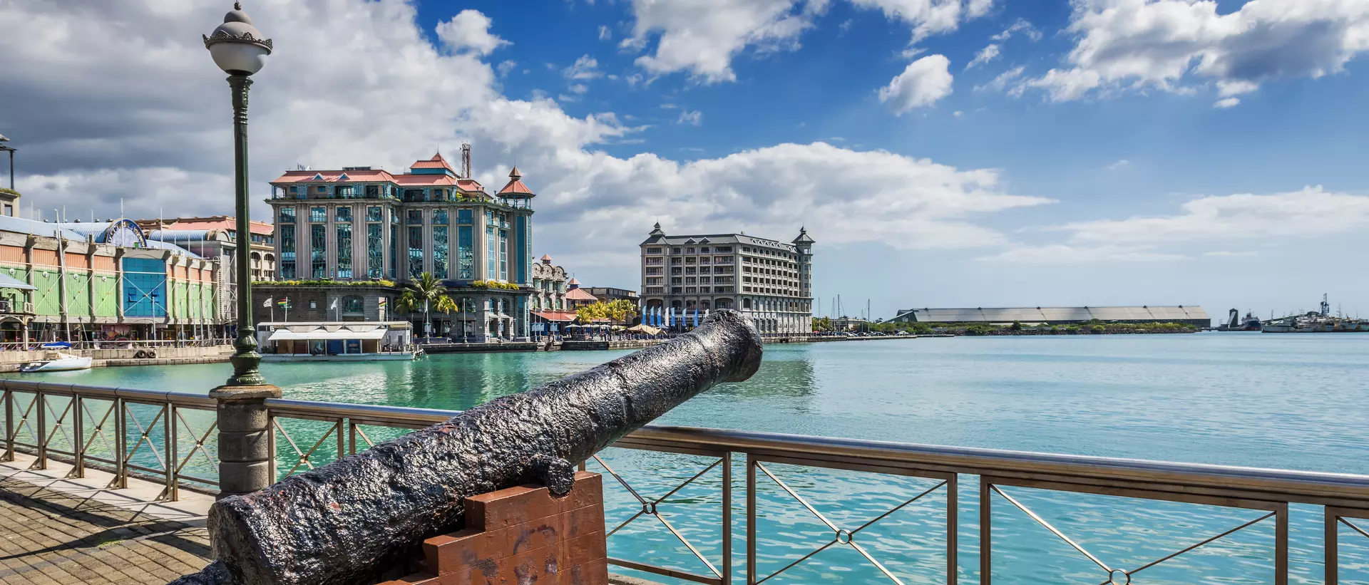 Old cannon on the promenade at Caudan Waterfront, Port Louis, Mauritius.