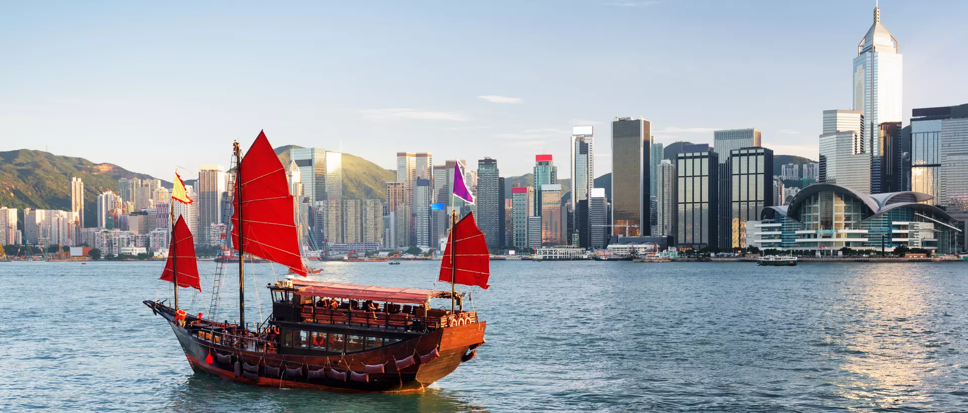 Scenic view of a traditional Chinese junk in Victoria harbor, Hong Kong.