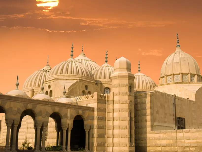 Arabic domes at sunset in Cairo make for a great photo while on your Egypt vacation.