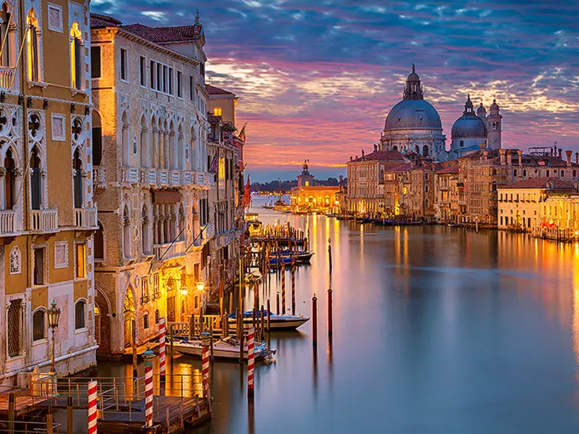 The famous Grand Canal from Rialto Bridge is a must photograph spot while on your Italy vacation.