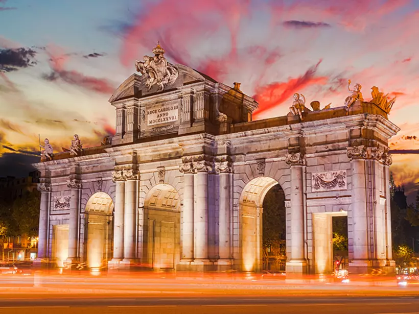 Capture neo-classic beauty when visiting the arching Puerta de Alcala