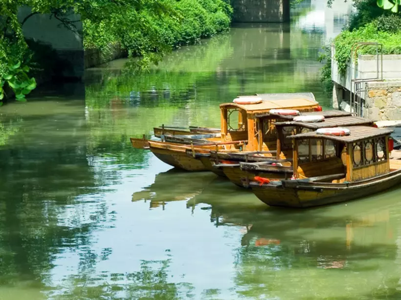 Travelling by boat on the canals of Suzhou is a popular inclusion for China tours.