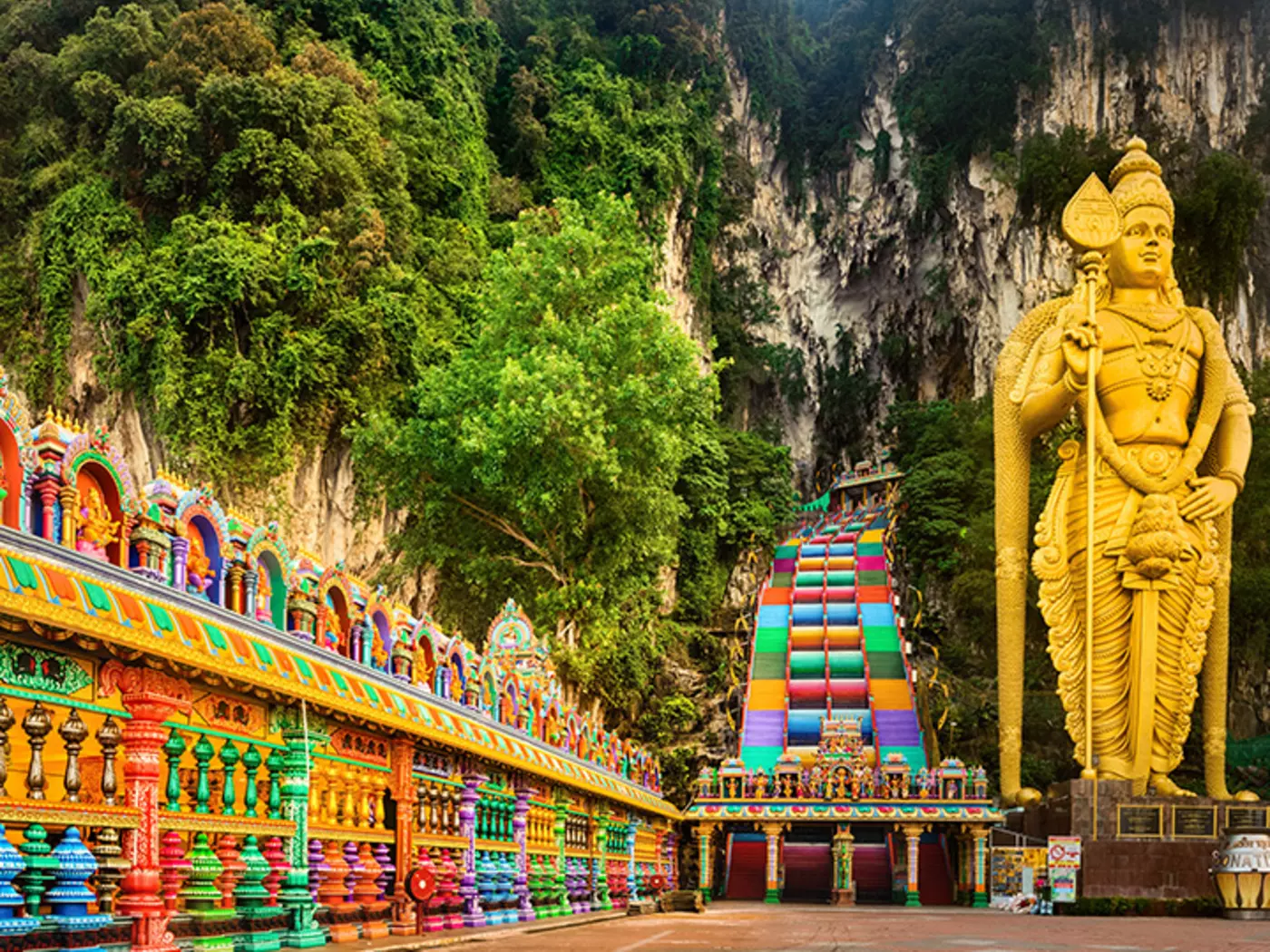 Walk the colourful steps to the Batu caves, a popular pilgrimage stop