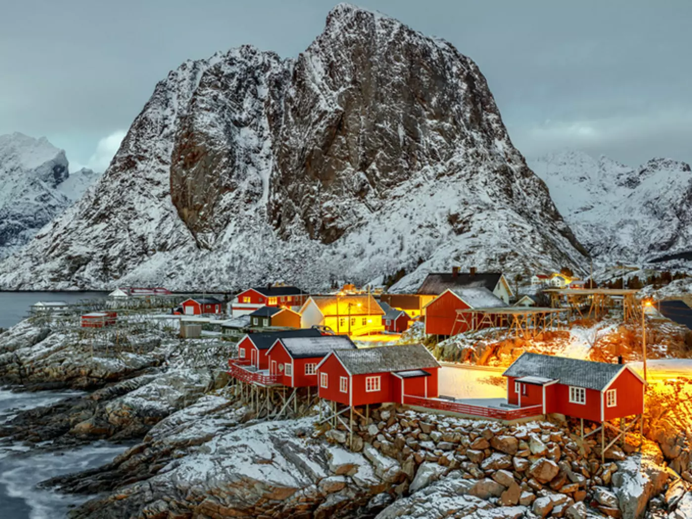 Match majestic mountains with white sandy beaches on the Lofoten Islands, a popular fishing spot in Norway
