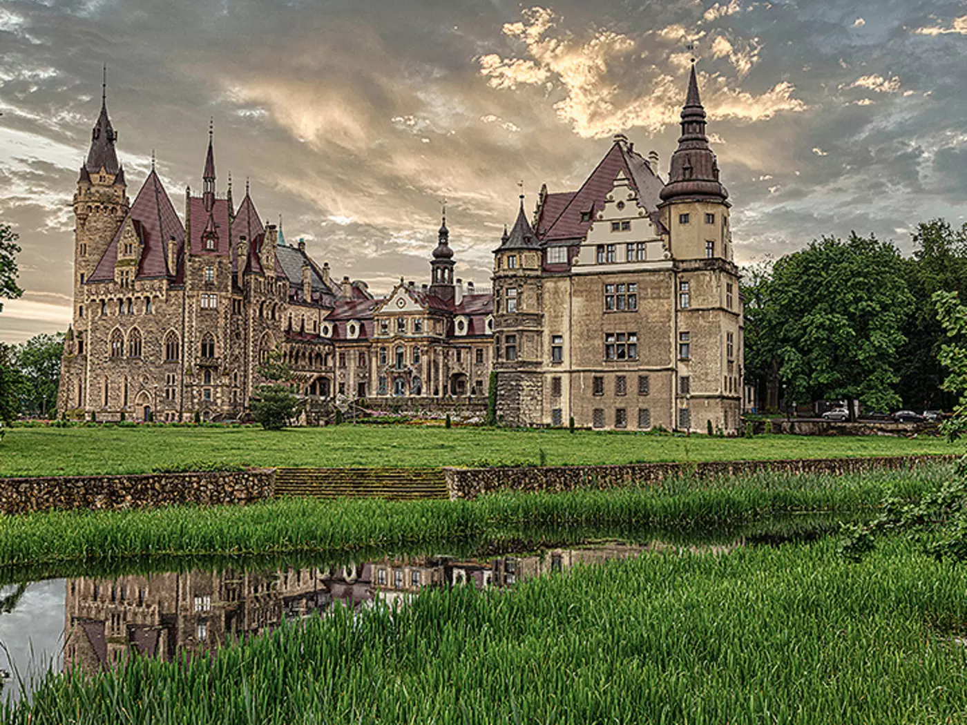 Stroll the romantic grounds of Moszna Castle, surrounded by acres of park