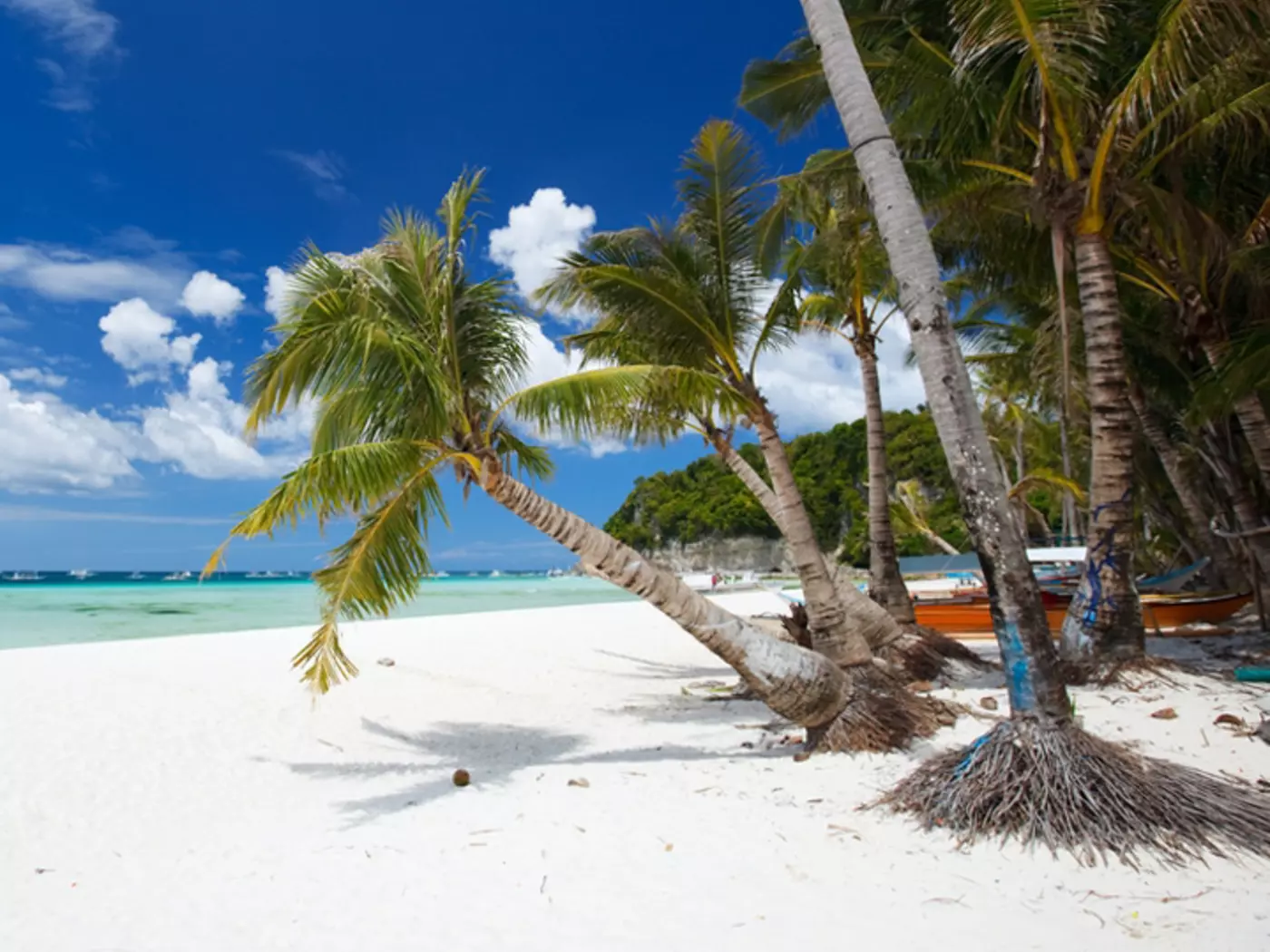 Take a day to relax in the sun on the sandy shores of Boracay