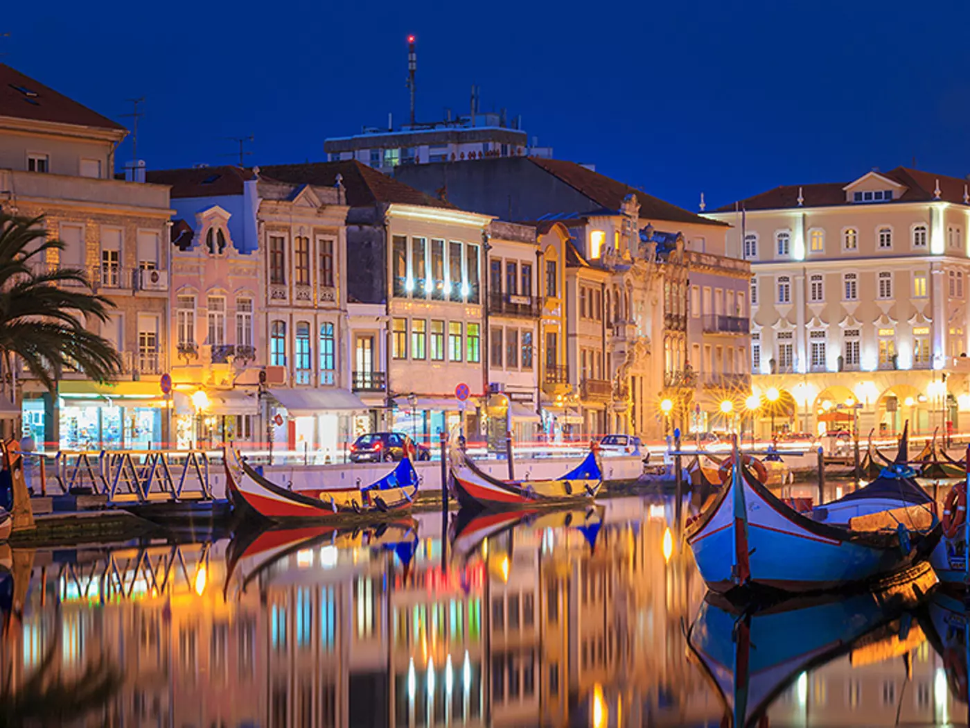 Navigate Aveiro's canals on colourful barcos moliceiros