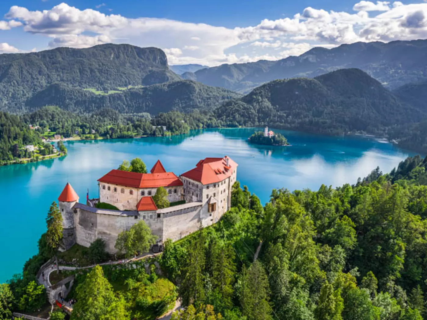 The most beautiful view of Bled, its island, and surrounding peaks is from the castle towering over the lake