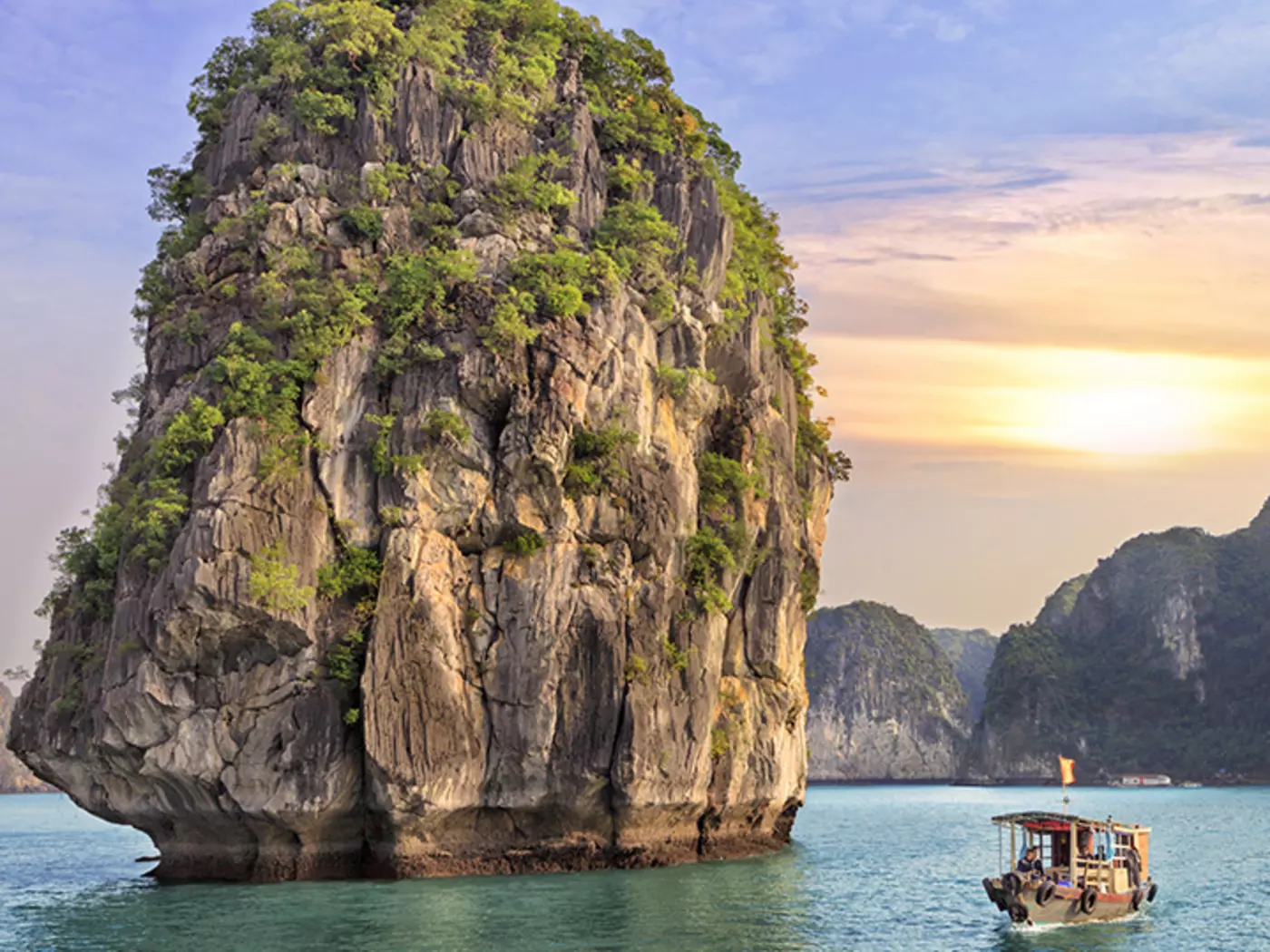 Cruise along the calming waters and unique rock formations of Halong Bay
