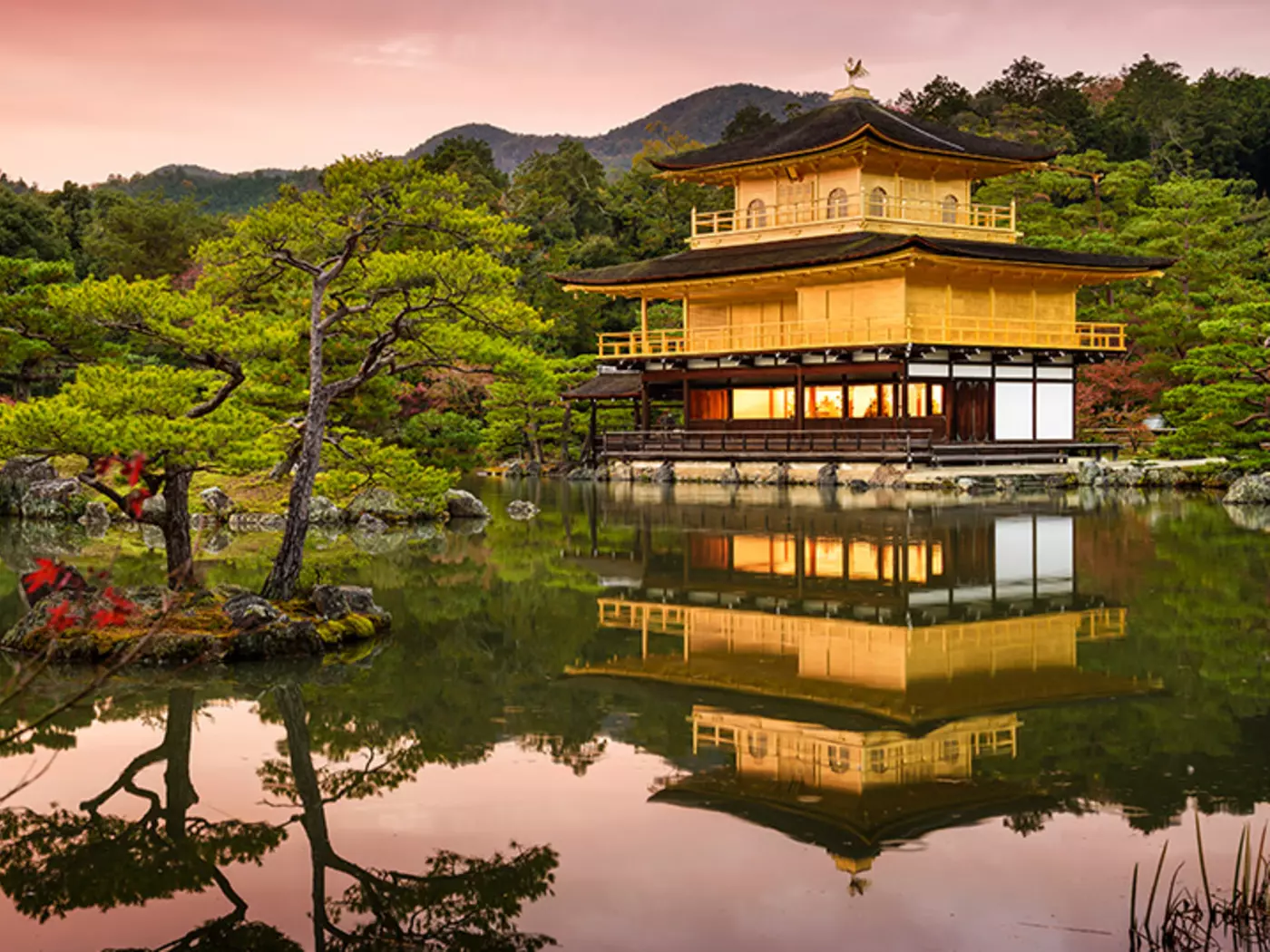 Exploring the shimmering beauty of Kinkaku-ji, also known as the Golden Temple due to the top two floors being coated in gold leaf