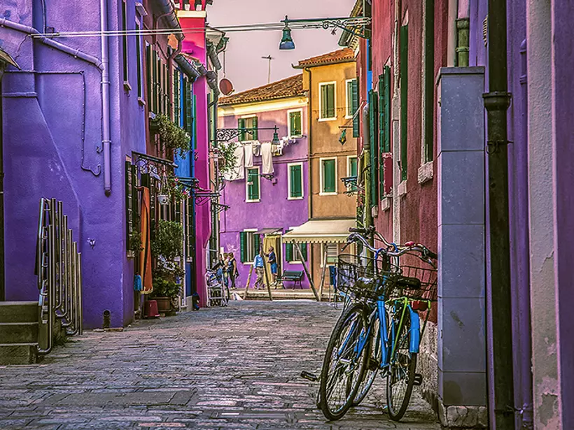 Escape the busy streets of Venice to tour the Pastel Buildings of Burano Island in the Venetian Lagoon