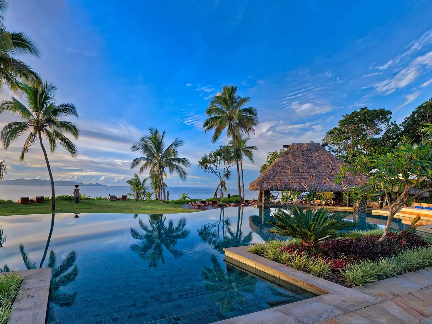 Relax by the pool at Nanuku Resort