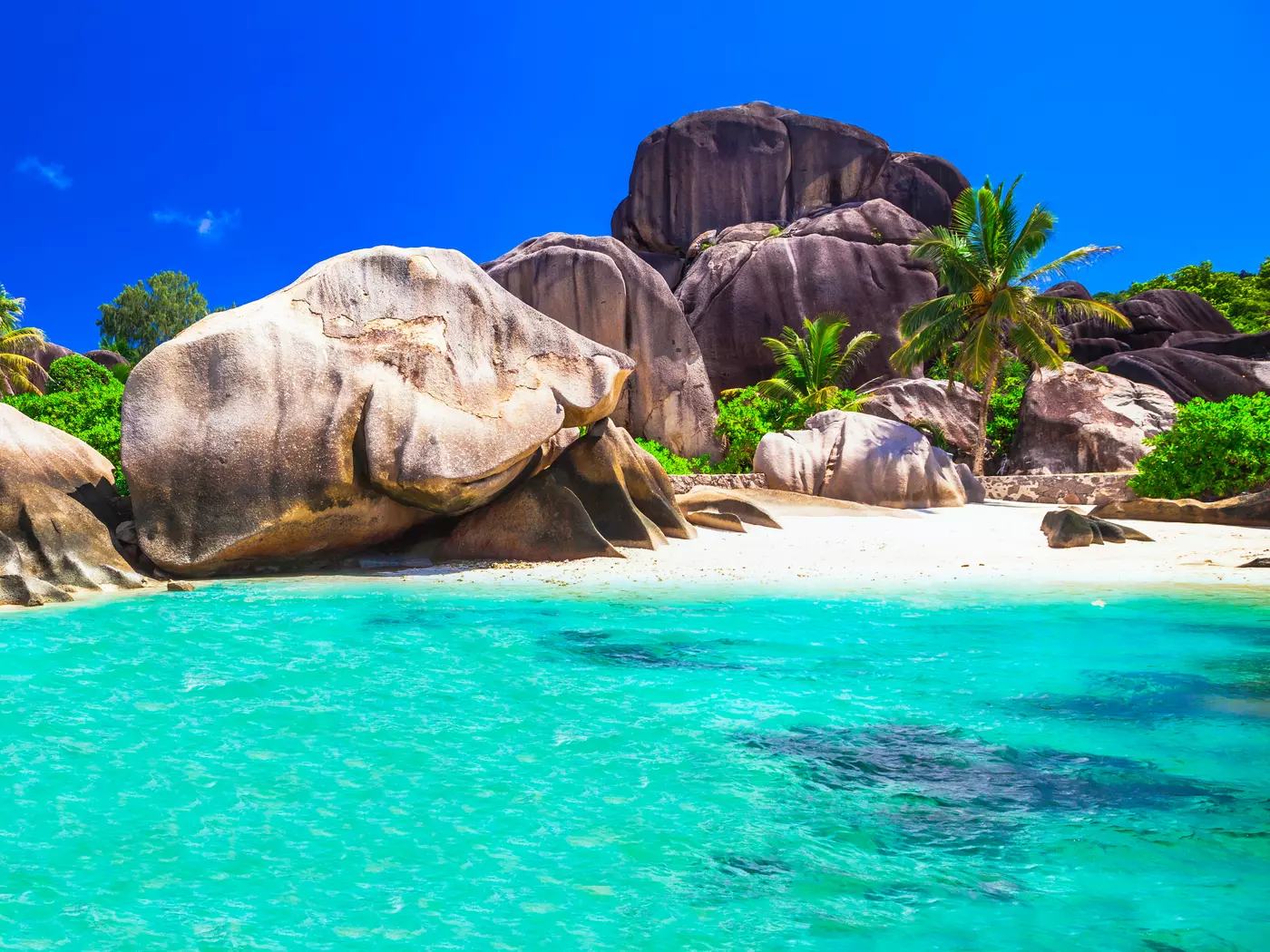 Beaches on the west coast of La Digue are dotted with granite boulders and are protected by a reef wall.