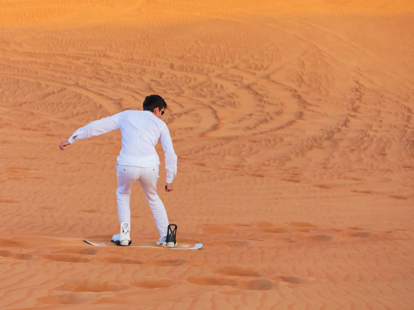 Sandboarding on desert dunes, Dubai safari