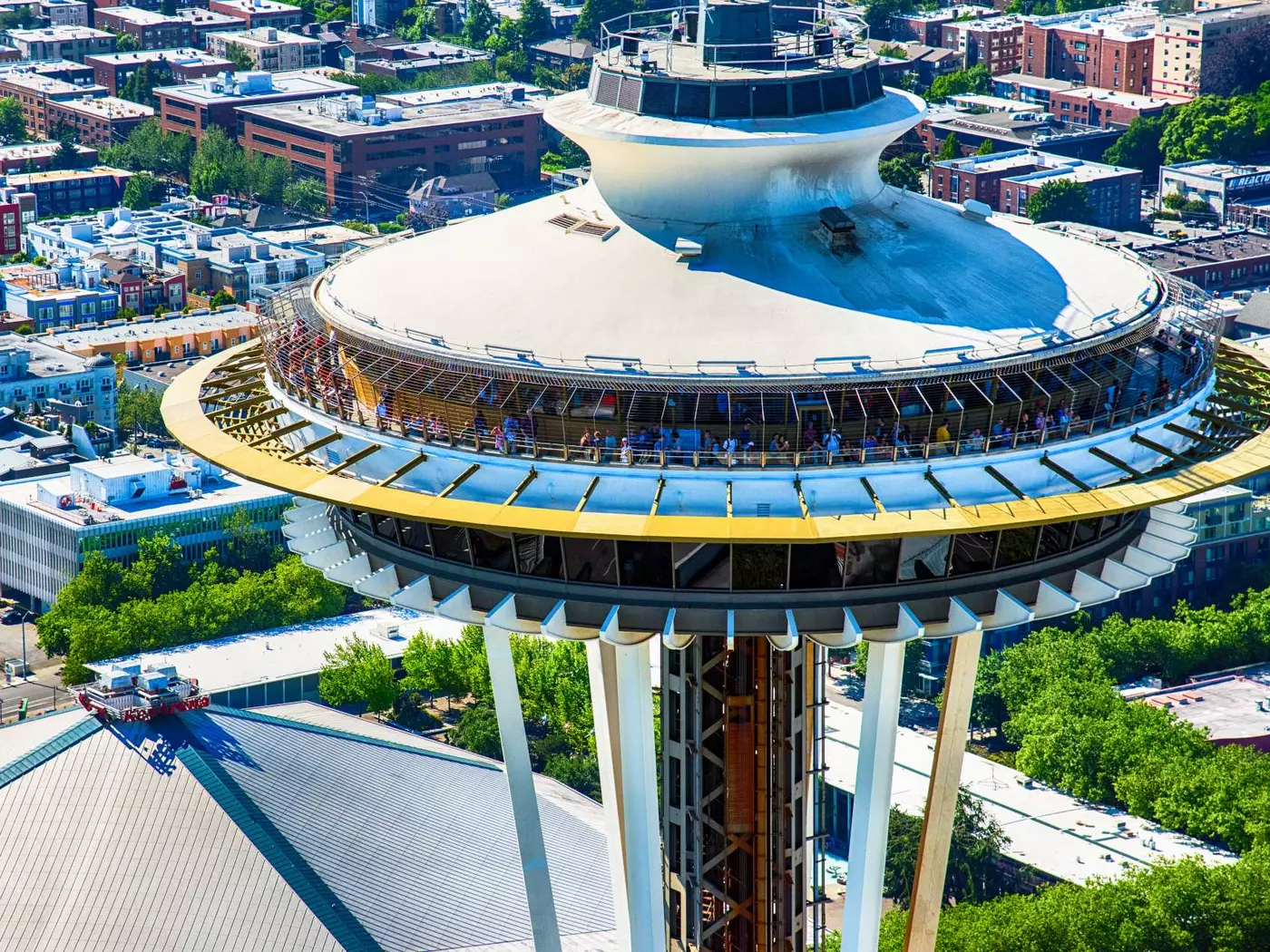 Close up of tourists gathered on the viewing deck of the Space Needle in Seattle Washington as shot from an orbiting helicopter.
