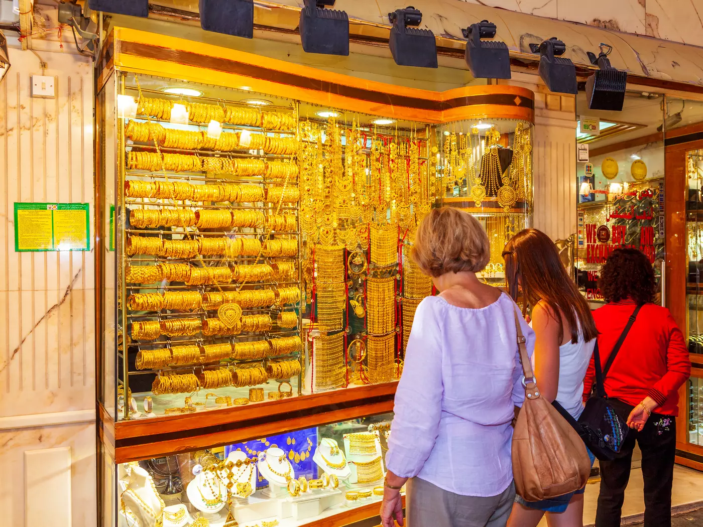 Women shop at the window of a store in Dubai's Gold Souk.