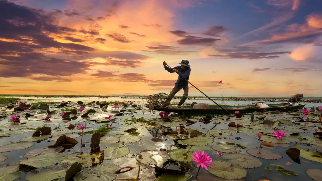 Fisherman boating at sunrise on Yangtze River, China