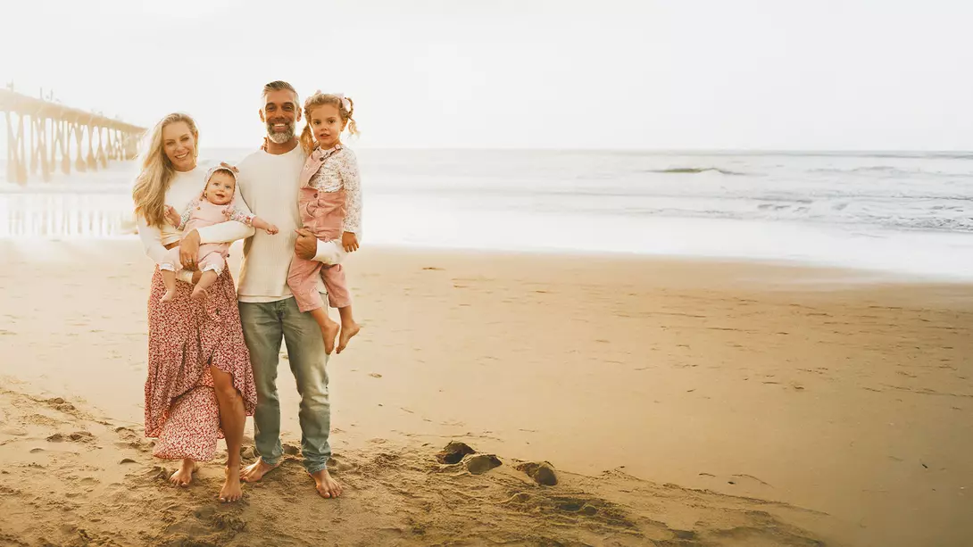 Amber Pfister and her family pose on Hermosa Beach in California.