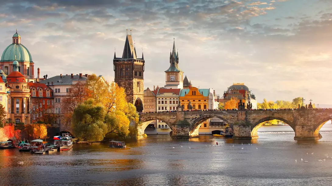A sunset view of Charles Bridge in the downtown of Prague, Czechia.
